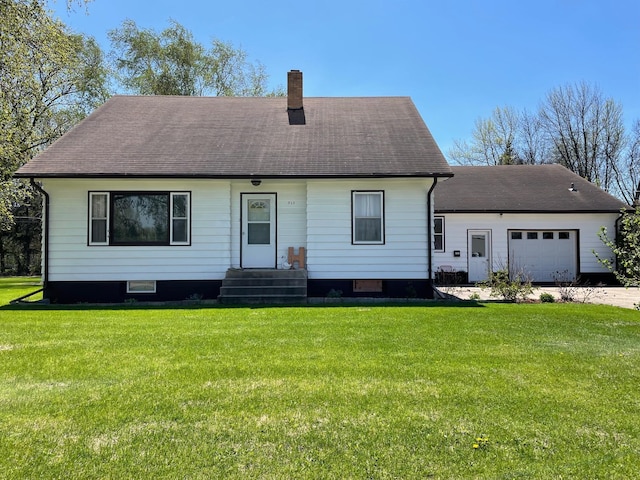 912 3rd St NE, Roseau, MN 56751 - view of front of property with a chimney, a front yard, a shingled roof, and a garage