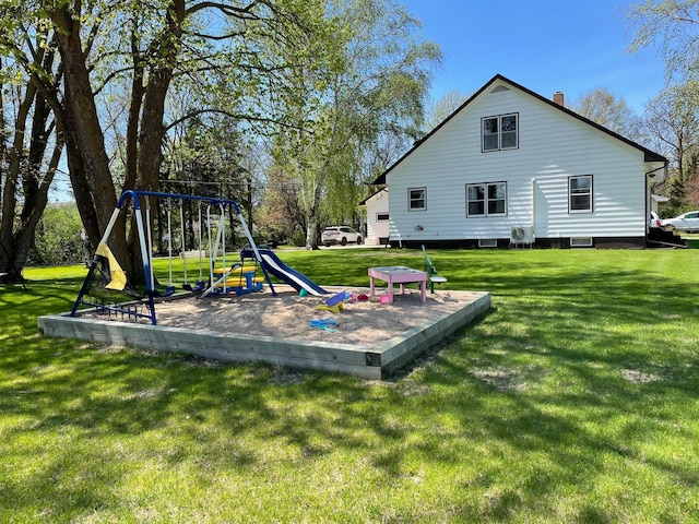 912 3rd St NE, Roseau, MN 56751 - back of house featuring a playground and a lawn