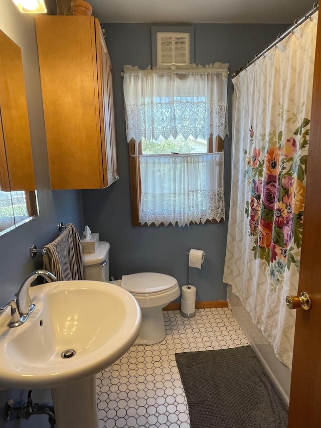 912 3rd St NE, Roseau, MN 56751 - bathroom featuring toilet and a sink