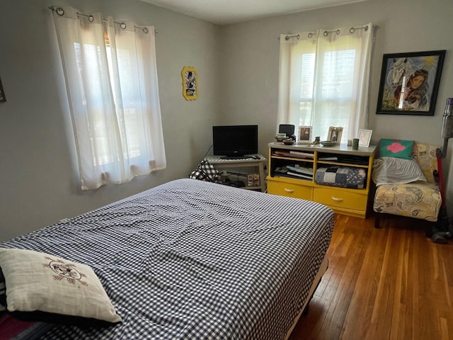 912 3rd St NE, Roseau, MN 56751 - bedroom with hardwood / wood-style flooring
