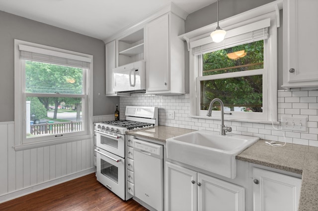 6045 Oakland Ave, Minneapolis, MN 55417 - kitchen with white appliances, open shelves, healthy amount of natural light, dark wood-style floors, and a wainscoted wall