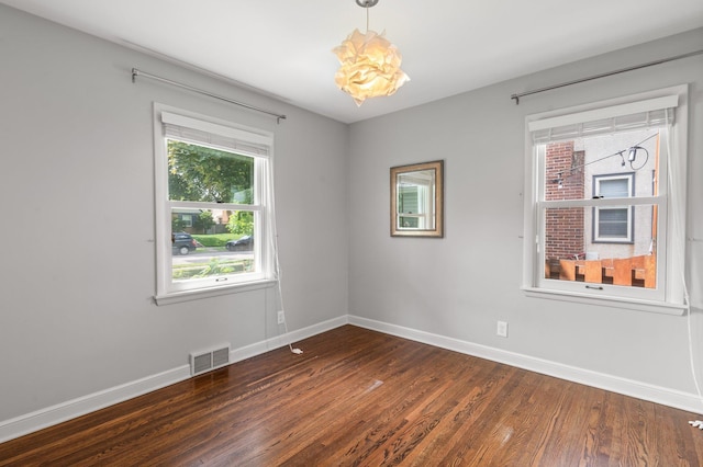 6045 Oakland Ave, Minneapolis, MN 55417 - unfurnished room with dark wood-type flooring and baseboards