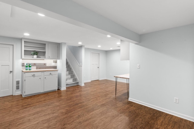 6045 Oakland Ave, Minneapolis, MN 55417 - bar area with dark wood-style flooring, recessed lighting, and stairway