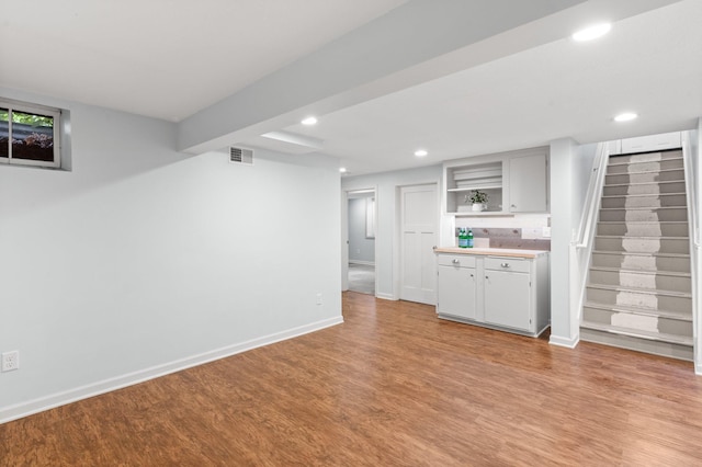 6045 Oakland Ave, Minneapolis, MN 55417 - indoor bar with light wood-style flooring, recessed lighting, and stairs