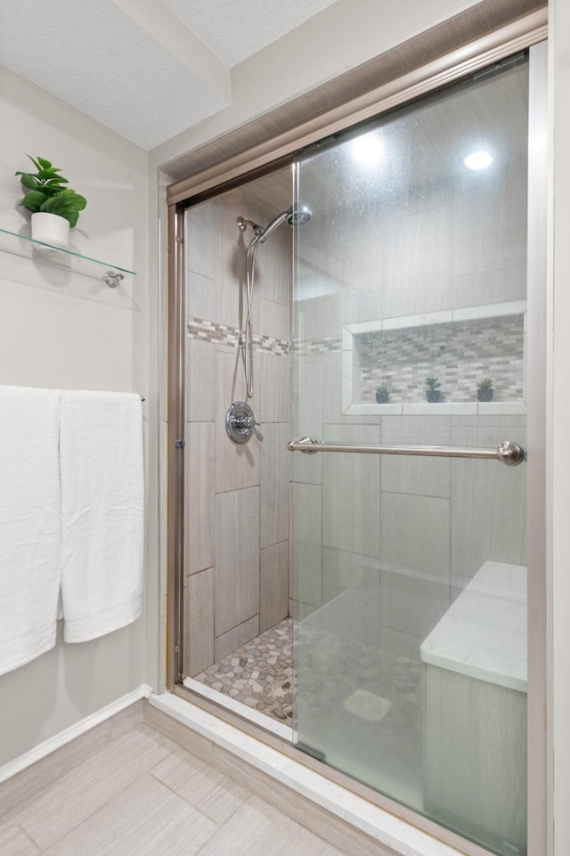 6045 Oakland Ave, Minneapolis, MN 55417 - full bathroom featuring a stall shower and baseboards