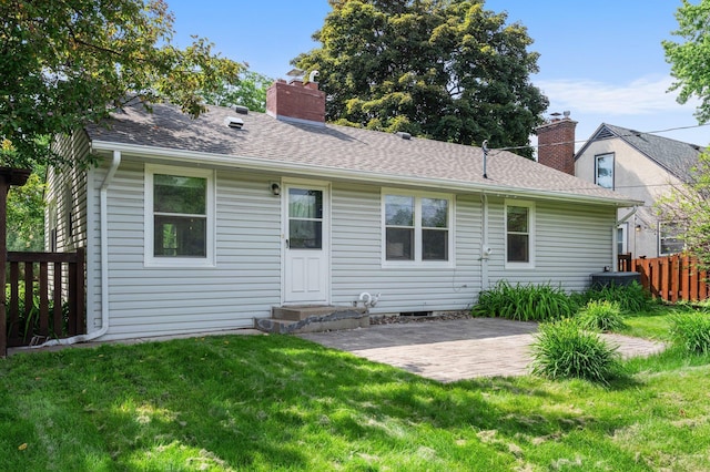 6045 Oakland Ave, Minneapolis, MN 55417 - rear view of property with a chimney, a patio area, and roof with shingles