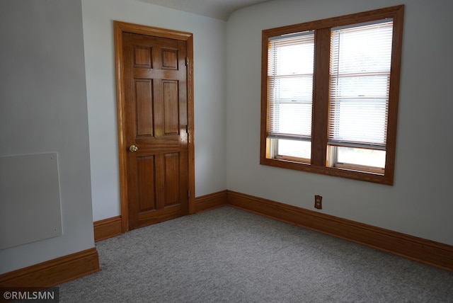 653 Thomas Ave, Saint Paul, MN 55104 - carpeted spare room with baseboards