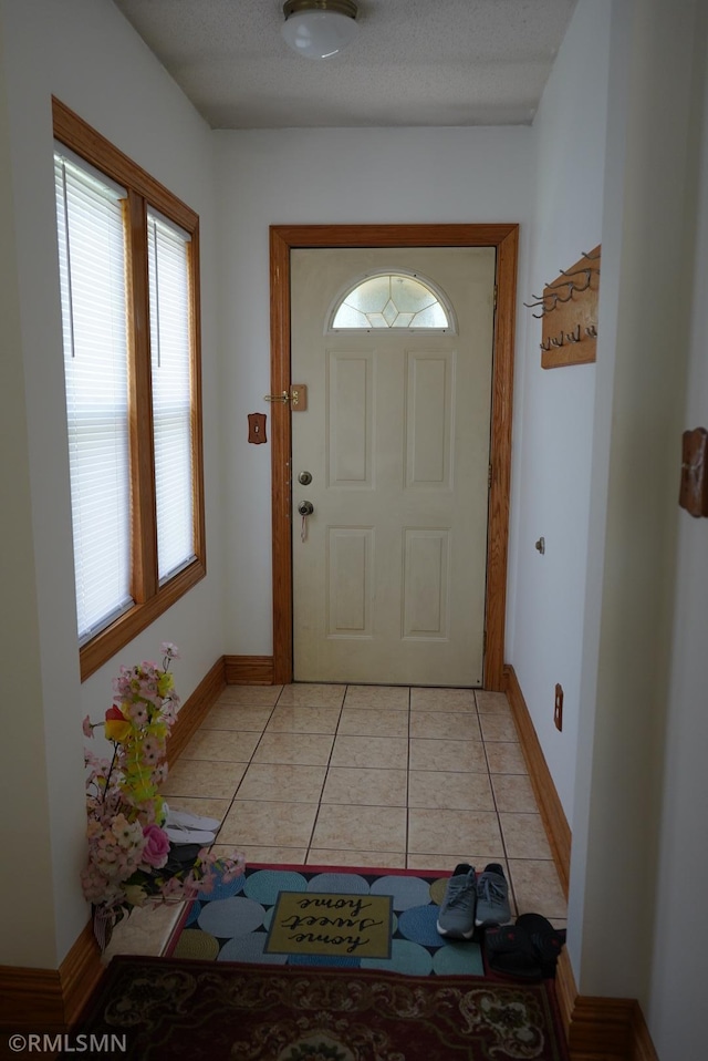 653 Thomas Ave, Saint Paul, MN 55104 - foyer entrance featuring baseboards and light tile patterned floors