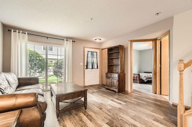 2225 Ranchview Ln N Unit 5, Plymouth, MN 55447 - living room featuring light wood-type flooring and a textured ceiling