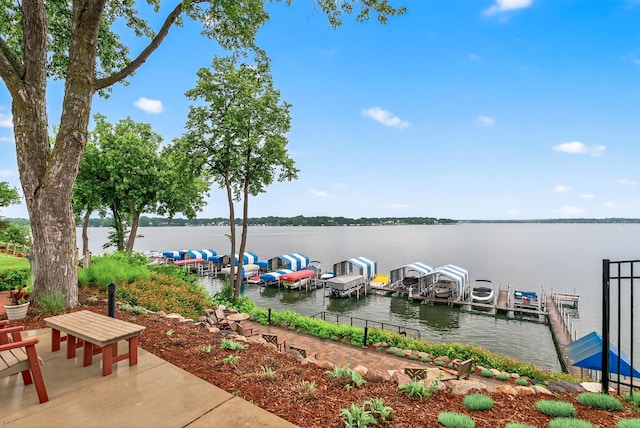 4371 Wilshire Blvd Unit 107, Mound, MN 55364 - view of patio featuring a boat dock and a water view