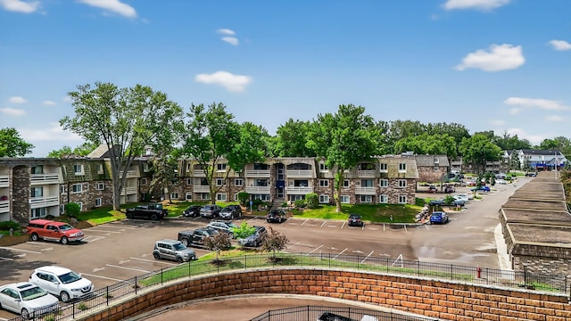 4371 Wilshire Blvd Unit 107, Mound, MN 55364 - view of community with uncovered parking and a residential view