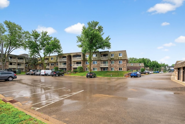 4371 Wilshire Blvd Unit 107, Mound, MN 55364 - view of building exterior featuring uncovered parking