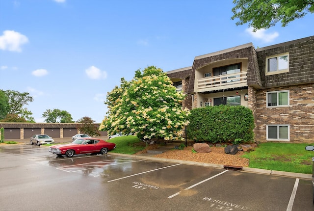 4371 Wilshire Blvd Unit 107, Mound, MN 55364 - view of property featuring uncovered parking