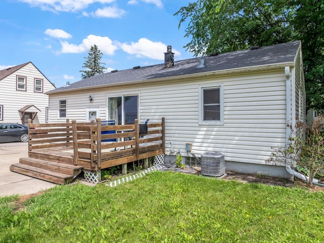 1622 3rd St NE, Rochester, MN 55906 - back of property featuring a deck, a lawn, and a chimney
