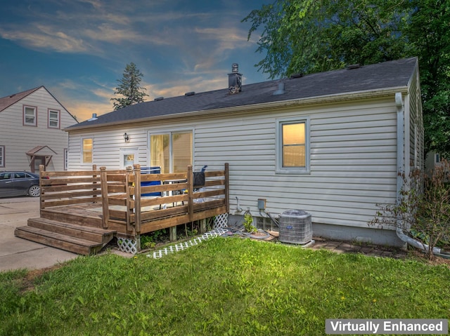 1622 3rd St NE, Rochester, MN 55906 - back of property with a wooden deck and a yard