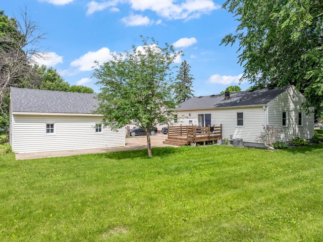 1622 3rd St NE, Rochester, MN 55906 - rear view of house with a wooden deck, a lawn, a patio, and a shingled roof