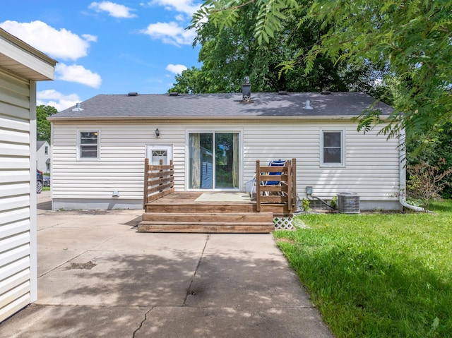 1622 3rd St NE, Rochester, MN 55906 - back of property with a patio, a deck, a shingled roof, and a yard
