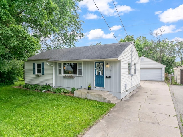 1622 3rd St NE, Rochester, MN 55906 - view of front of house featuring a detached garage, an outdoor structure, a front lawn, and a shingled roof