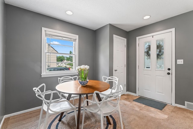 1622 3rd St NE, Rochester, MN 55906 - dining room with light colored carpet, recessed lighting, and a textured ceiling