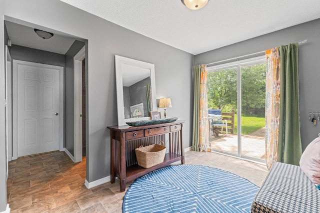 1622 3rd St NE, Rochester, MN 55906 - sitting room featuring stone finish flooring and baseboards