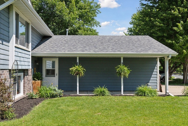 704 Lexington Ave N, New Prague, MN 56071 - view of property exterior with a lawn and a shingled roof