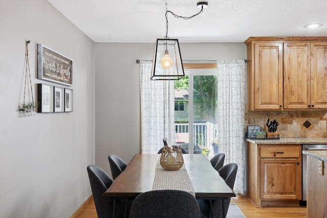 704 Lexington Ave N, New Prague, MN 56071 - dining room featuring light wood-style floors