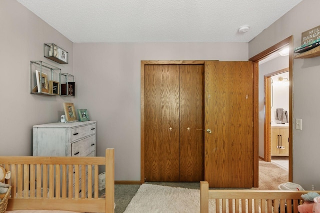704 Lexington Ave N, New Prague, MN 56071 - carpeted bedroom featuring a closet and a textured ceiling