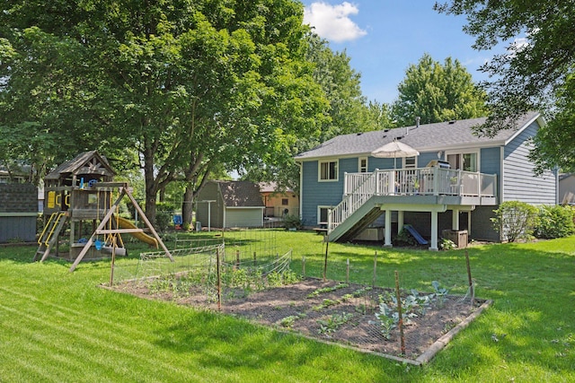 704 Lexington Ave N, New Prague, MN 56071 - rear view of house with a garden, a wooden deck, a playground, and stairway