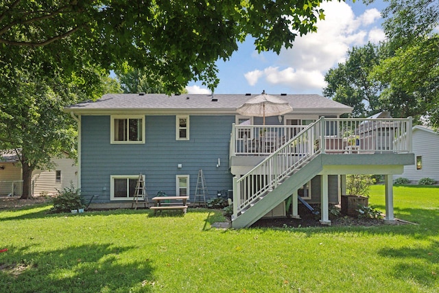 704 Lexington Ave N, New Prague, MN 56071 - back of house with stairway, a deck, and a lawn