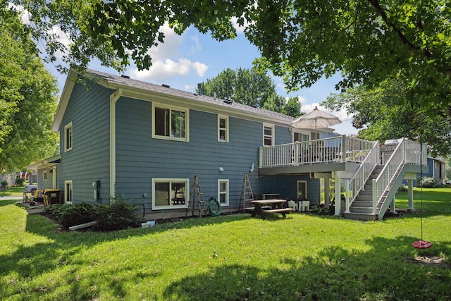 704 Lexington Ave N, New Prague, MN 56071 - back of house with stairs, a deck, and a lawn