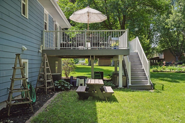 704 Lexington Ave N, New Prague, MN 56071 - view of grassy yard featuring stairs and a wooden deck