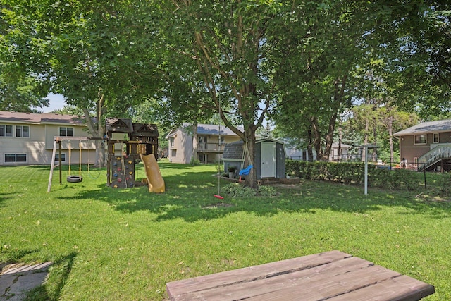 704 Lexington Ave N, New Prague, MN 56071 - view of yard featuring a storage unit and a playground