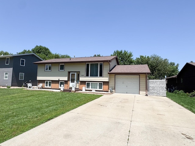 1908 Summit Ave, Worthington, MN 56187 - raised ranch with a garage, driveway, and a front lawn