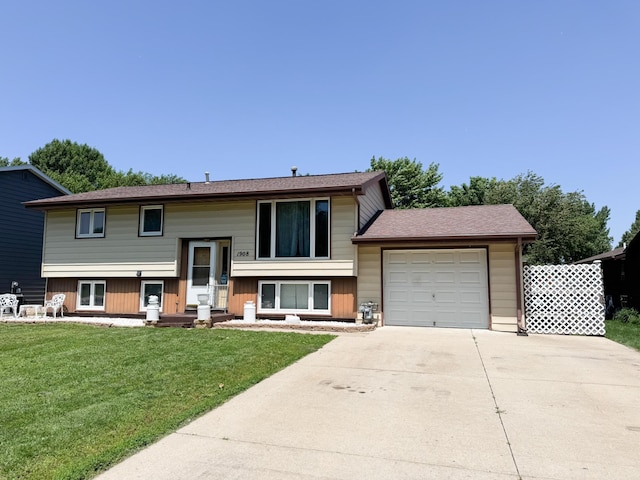 1908 Summit Ave, Worthington, MN 56187 - bi-level home with driveway, a garage, and a front yard