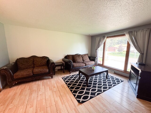 1908 Summit Ave, Worthington, MN 56187 - living room with wood finished floors and a textured ceiling