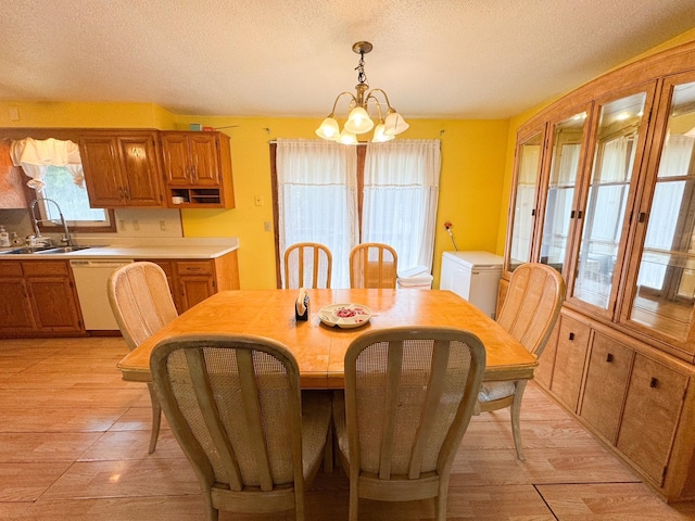 1908 Summit Ave, Worthington, MN 56187 - dining room with a textured ceiling and a chandelier