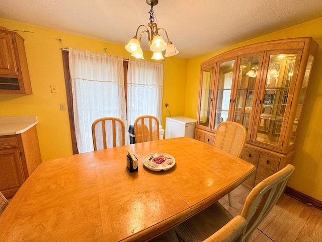1908 Summit Ave, Worthington, MN 56187 - dining room featuring a chandelier and wood finished floors
