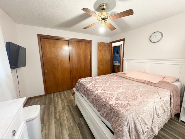 1908 Summit Ave, Worthington, MN 56187 - bedroom featuring a closet, dark wood-style floors, ceiling fan, a textured ceiling, and wainscoting