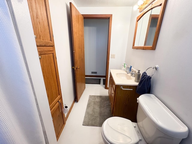 1908 Summit Ave, Worthington, MN 56187 - bathroom featuring toilet and vanity