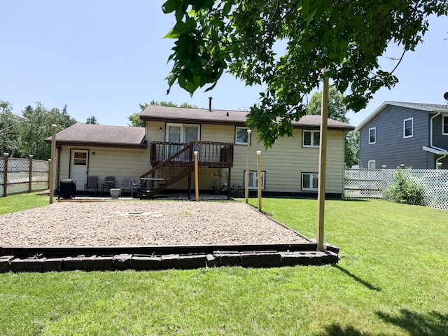 1908 Summit Ave, Worthington, MN 56187 - back of property featuring a fenced backyard and a wooden deck