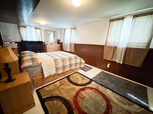 1908 Summit Ave, Worthington, MN 56187 - bedroom featuring a wainscoted wall and wooden walls