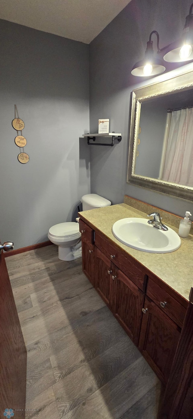 961 39 1/2 Ave W, West Fargo, ND 58078 - bathroom featuring wood finished floors and vanity
