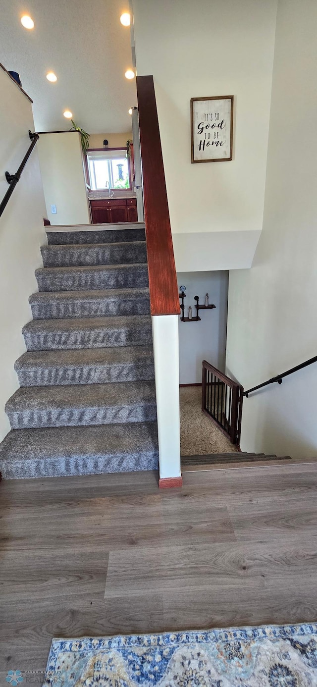 961 39 1/2 Ave W, West Fargo, ND 58078 - stairway featuring wood finished floors and recessed lighting