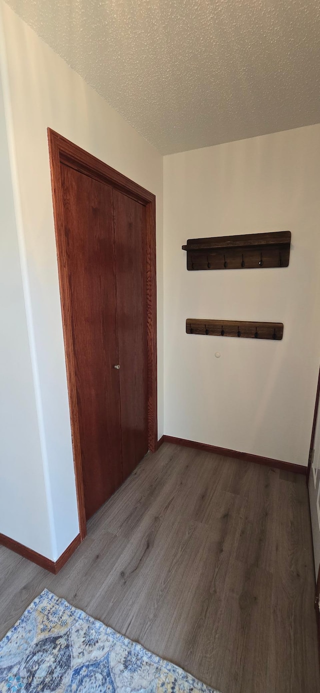 961 39 1/2 Ave W, West Fargo, ND 58078 - unfurnished bedroom featuring wood finished floors, a closet, and a textured ceiling