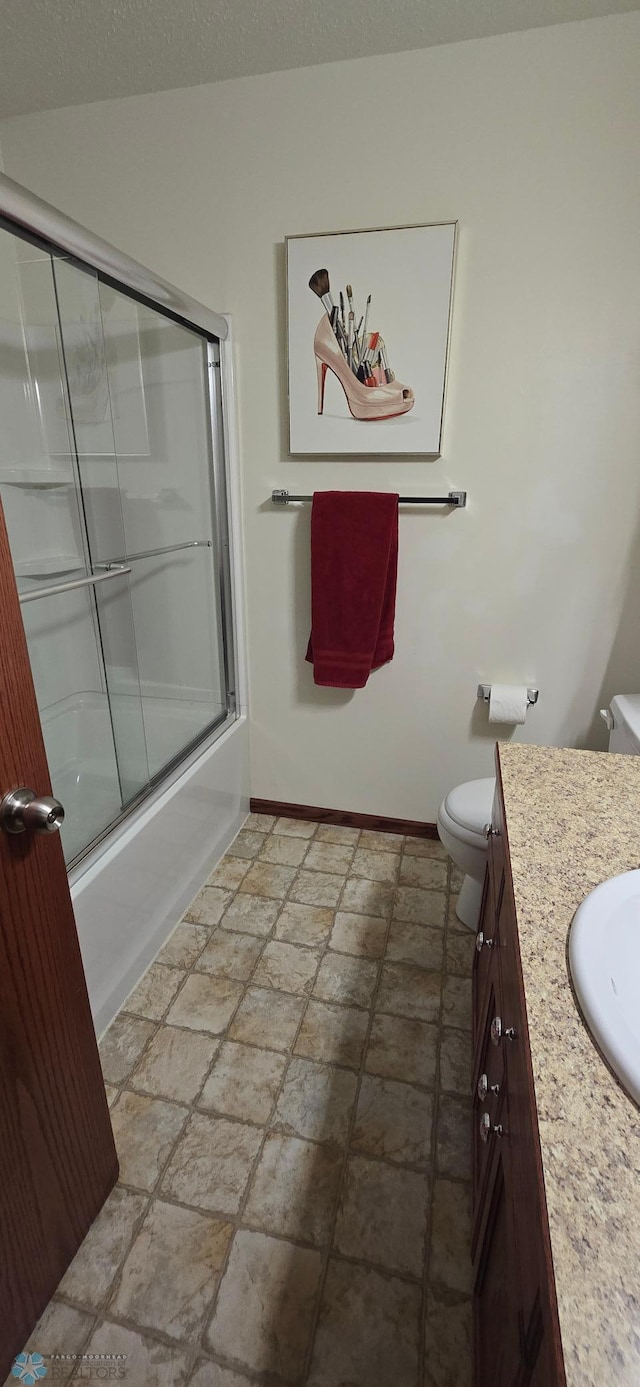 961 39 1/2 Ave W, West Fargo, ND 58078 - full bath featuring vanity, stone tile flooring, and shower / bath combination with glass door