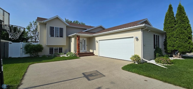 961 39 1/2 Ave W, West Fargo, ND 58078 - split level home featuring driveway, a garage, and a gate