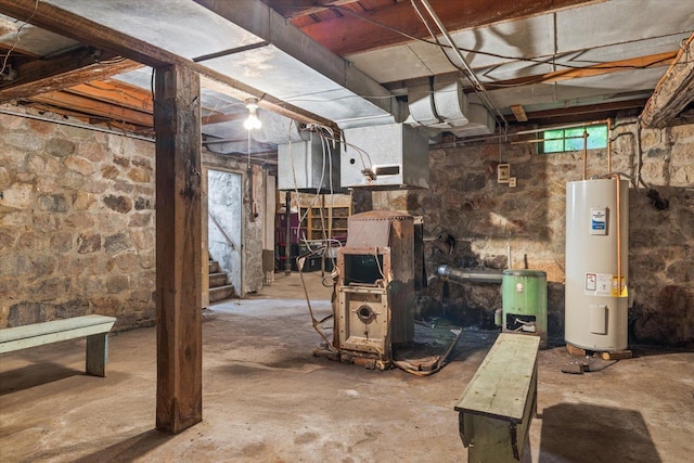 31905 Jefferson Blvd, Greenway Twp, MN 55775 - below grade area with electric water heater, healthy amount of natural light, stairway, and water heater