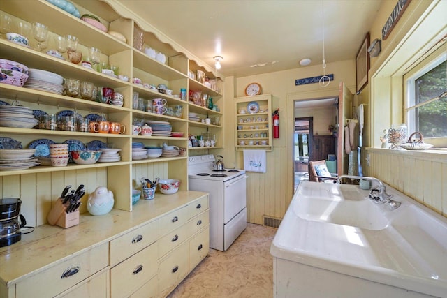 31905 Jefferson Blvd, Greenway Twp, MN 55775 - kitchen featuring white electric range, open shelves, and light countertops