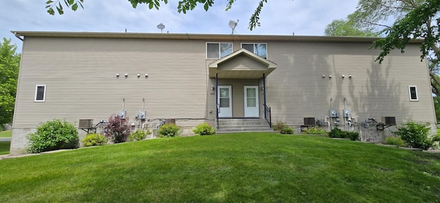 5293 Manchester Dr Unit 1, Maple Plain, MN 55359 - rear view of property featuring a yard and entry steps