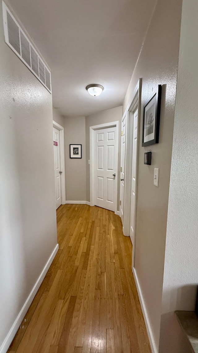 306 4th St, La Crescent, MN 55947 - hall featuring light wood-style flooring and baseboards